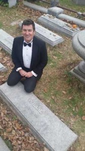 Your unabashed author, posing alongside the tombstone of William Gottfried Weiss, simply engraved “Willie.”